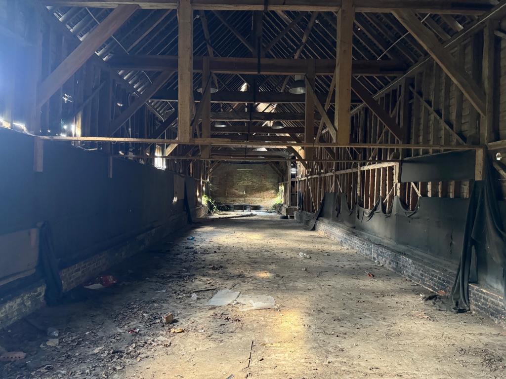 Lot: 109 - FREEHOLD BARN COMPLEX ON ALMOST THREE QUARTERS OF AN ACRE WITH POTENTIAL - Inside the long barn 1